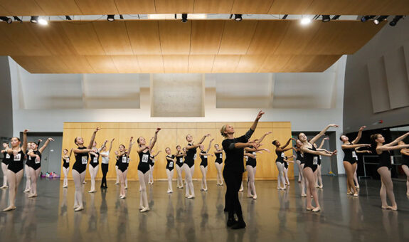 Ballet dancers in studio for center work